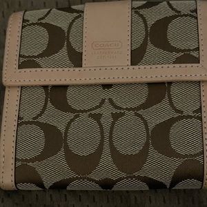 Coach EUC Trifold Wallet in the signature Coach Series.